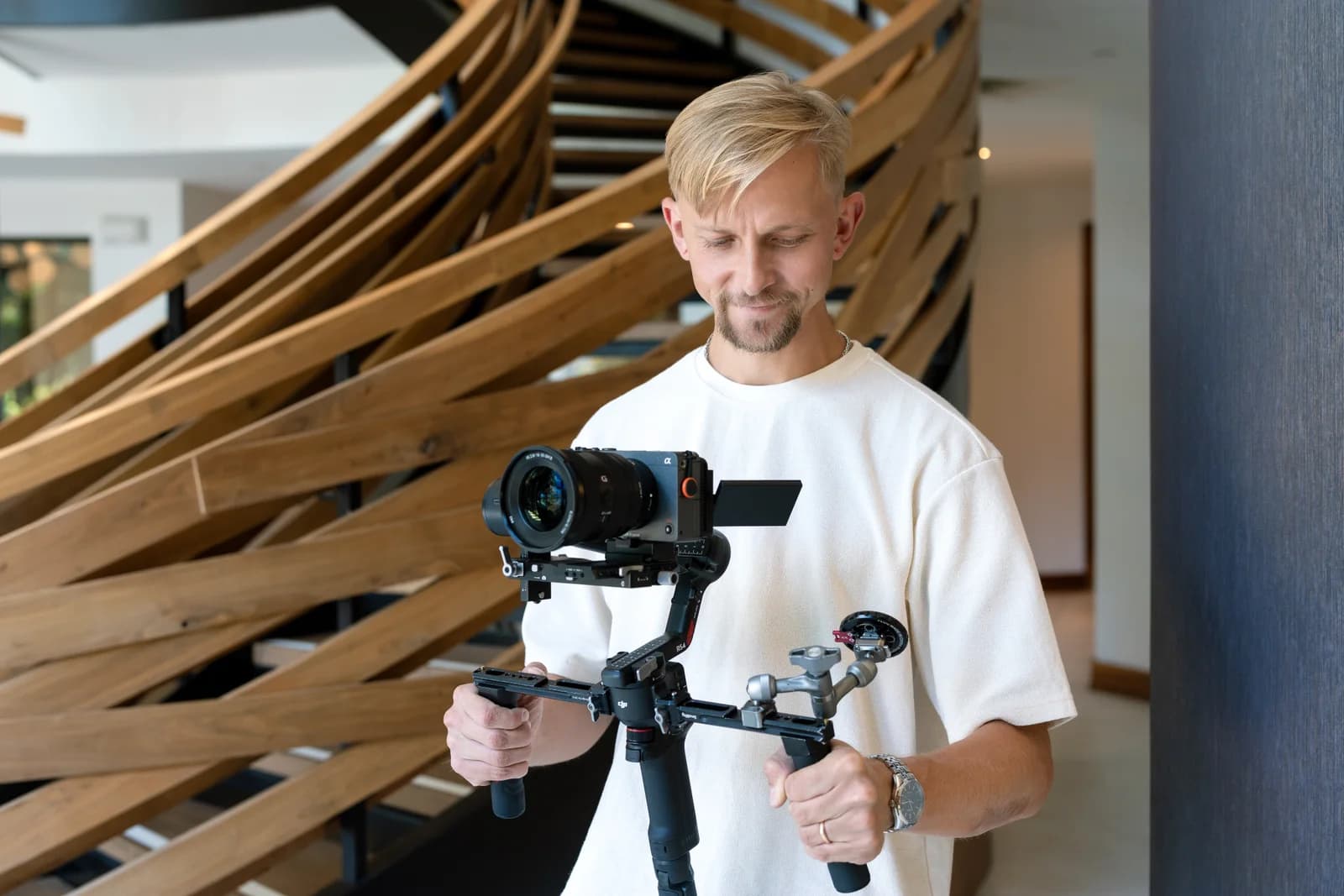 TNT videographer holding a camera mounted on a handheld stabilizer